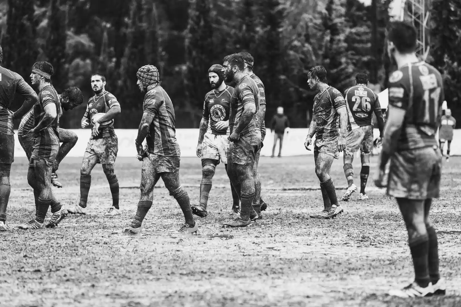 muddy rugby players